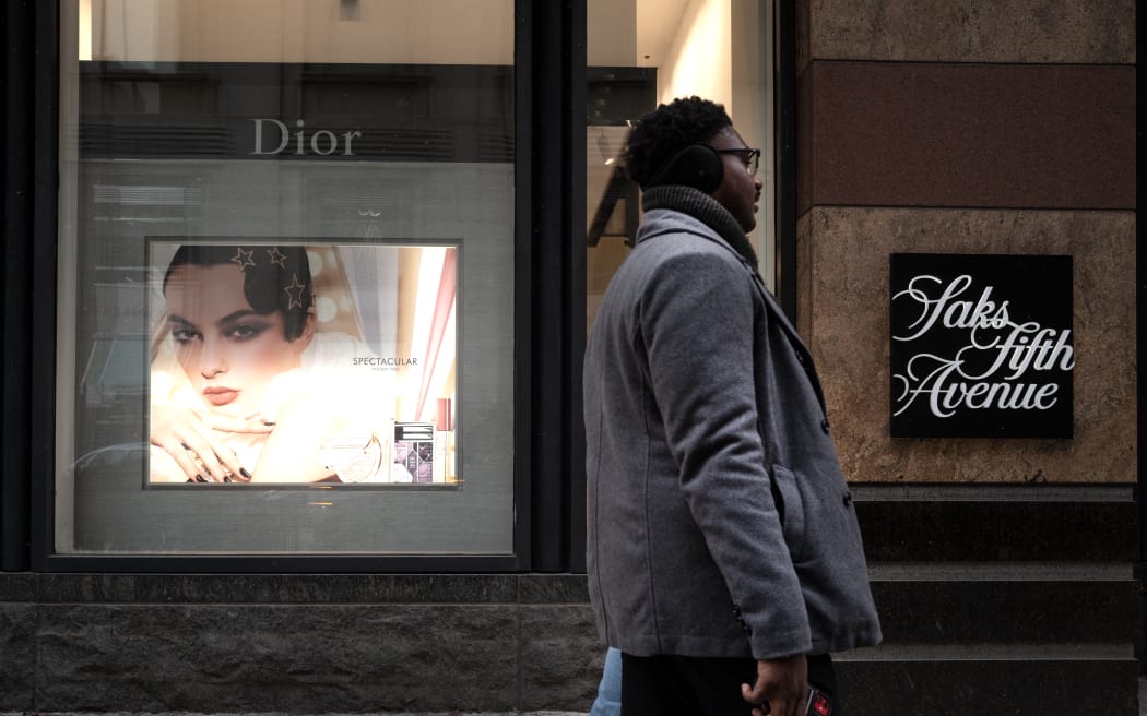 CHICAGO, ILLINOIS - DECEMBER 30: Pedestrians walk past a Saks Fifth Avenue store on December 30, 2025 in Chicago, Illinois. Recent reports indicate that Saks Global Enterprises, the parent corporation of Saks Fifth Avenue, may file for Chapter 11 bankruptcy as they face a more than $100 million debt payment due at the end of December.   Scott Olson/Getty Images/AFP (Photo by SCOTT OLSON / GETTY IMAGES NORTH AMERICA / Getty Images via AFP)