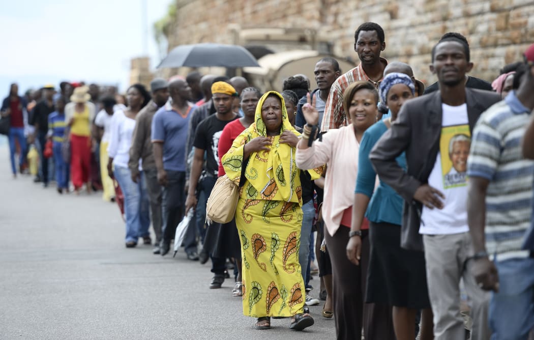 Long queues formed on the last day Mr Mandela's body lay in state.