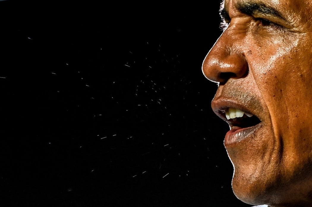Former US President Barack Obama speaks at a drive-in rally as he campaigns for Democratic presidential candidate former Vice President Joe Biden in Miami, Florida on November 2, 2020. (Photo by CHANDAN KHANNA / AFP)
