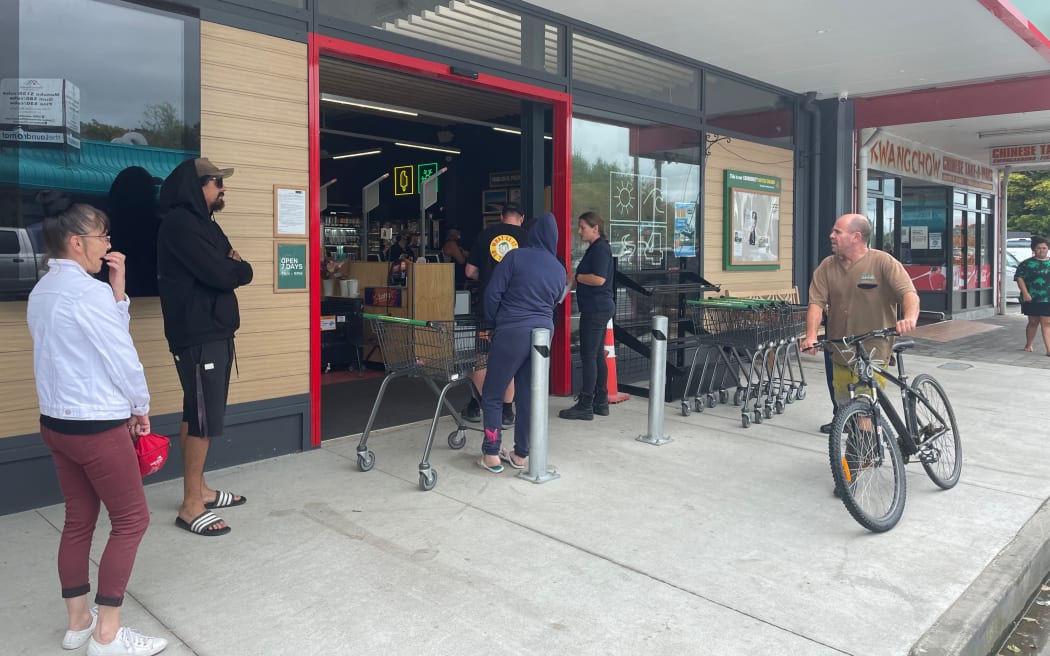 Queues for community supermarkets and petrol stations in Gisborne extended down the street on Wednesday afternoon.