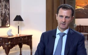 An image grab of Syrian President Bashar al-Assad speaking during an interview broadcast by Khabar TV, the news channel of the Islamic Republic of Iran.