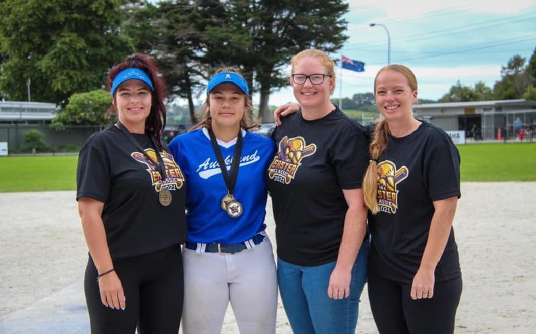 Members of the Bromhead family playing softball, from left Kyla, Tyarn, Tegan and Rebecca.