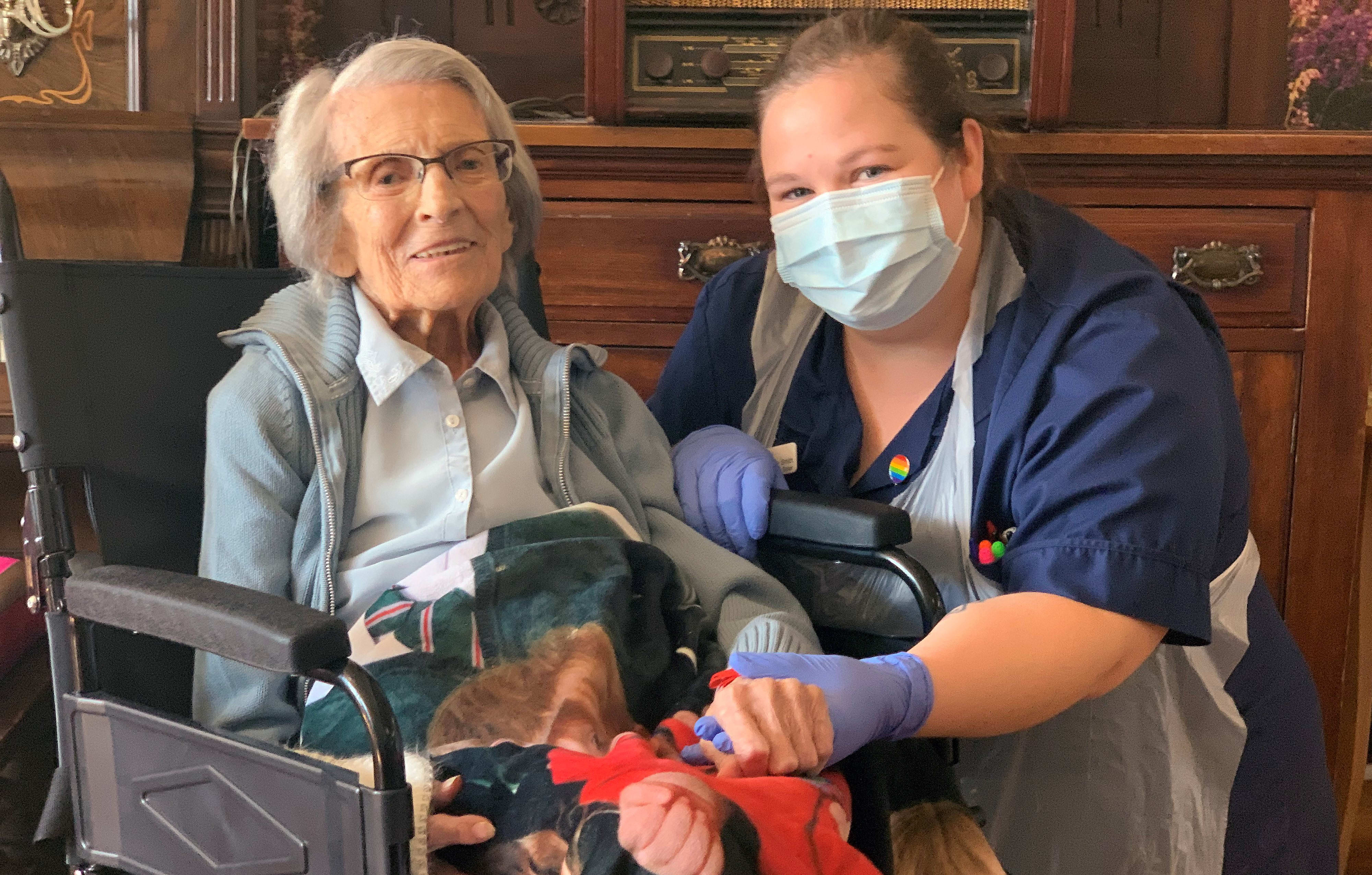 Recovered Covid-19 patient, 106-year-old Connie Titchen (left), with Sister Kelly Smith, posing for a photograph in Birmingham, central England.