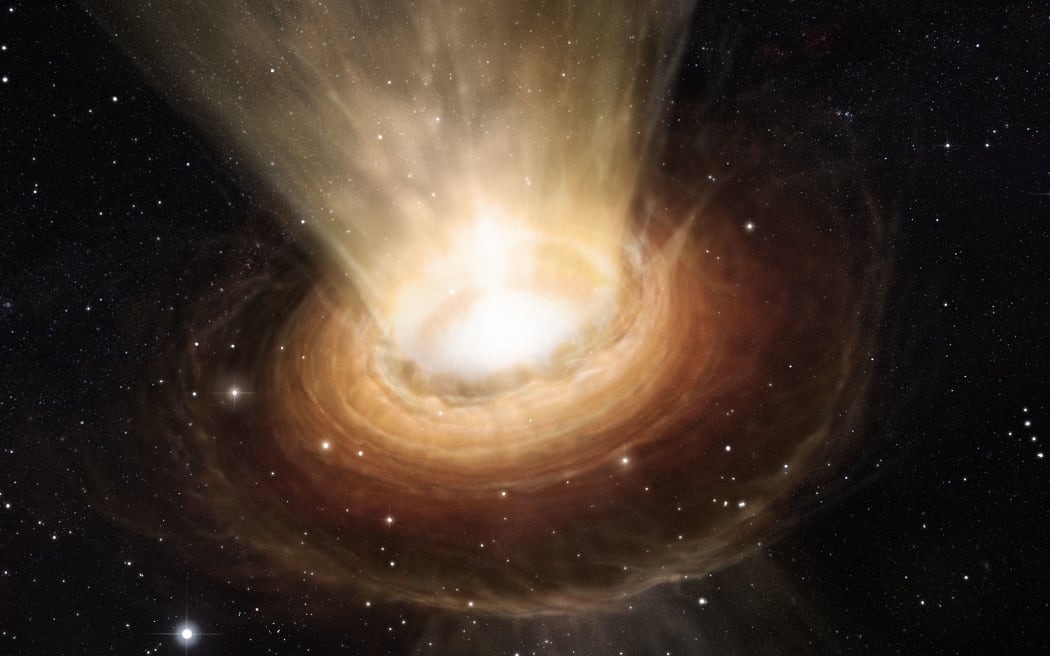 This image released by the European Southern Observatory (ESO) on June 19,2013 of an artist’s impression shows the surroundings of the supermassive black hole at the heart of the active galaxy NGC 3783 in the southern constellation of Centaurus (The Centaur). New observations using the Very Large Telescope Interferometer at ESO’s Paranal Observatory in Chile have revealed not only the torus of hot dust around the black hole but also a wind of cool material in the polar regions.
RESTRICTED TO EDITORIAL USE - MANDATORY CREDIT "AFP PHOTO / EUROPEAN SOUTHERN OBSERVATORY - M. KORNMESSER" - NO MARKETING NO ADVERTISING CAMPAIGNS - DISTRIBUTED AS A SERVICE TO CLIENTS (Photo by M. KORNMESSER / EUROPEAN SOUTHERN OBSERVATORY / AFP)