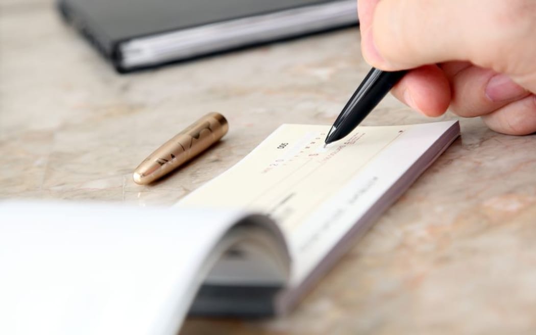 Cheque being signed