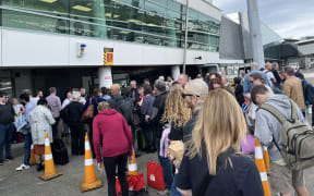Crowds outside Wellington Airport after it was evacuated.