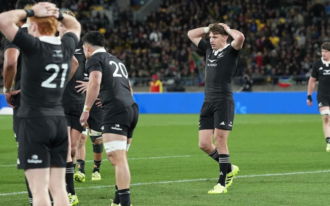 Beauden Barrett dejected as the All Blacks crash to a record loss.