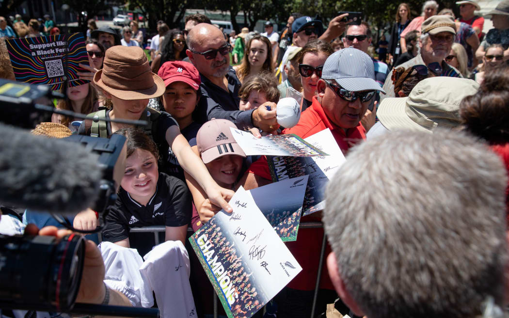 Fans celebrate the Black Ferns at an event at Parliament