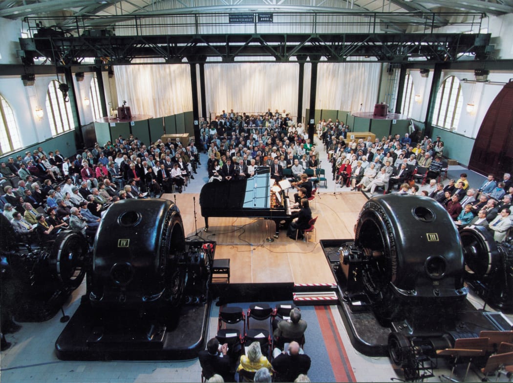 Musicians, turbines and audience at Power Plant in Heimbach