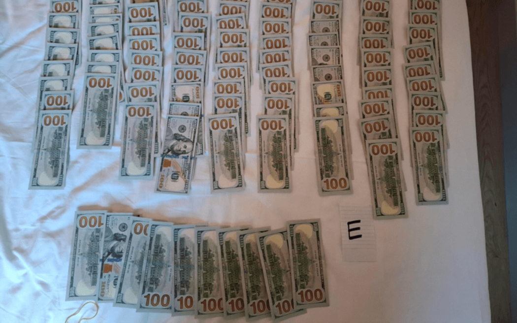 US$10 000 found in defendant's hotel room. Supplied by DOC