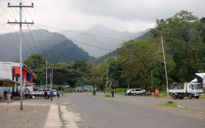 People at Alotau town street, hills view, Papua New Guinea, 2011.