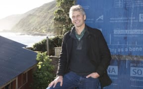 Chris Moller in front of the Wellington "Stilt House"
