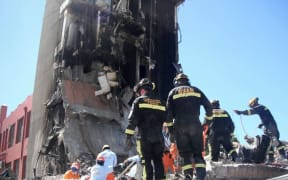Rescue workers at the ruins of the CTV building.