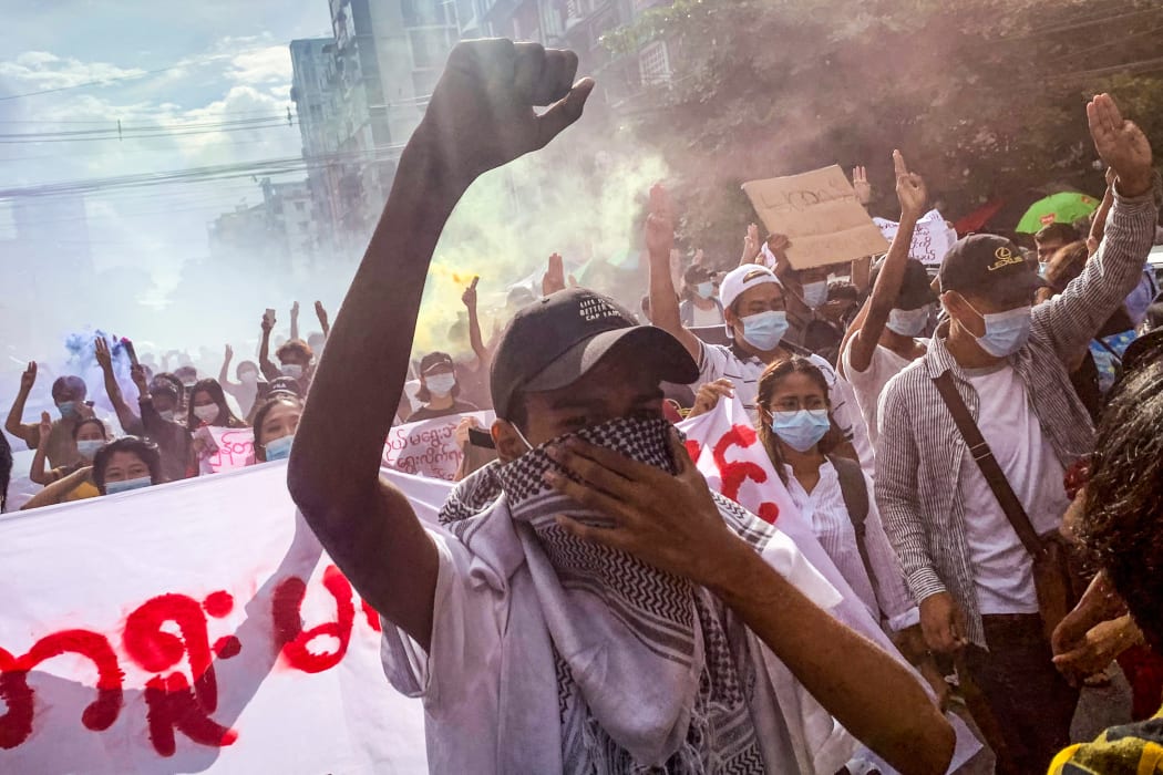 Protesters take part in a demonstration against the military coup in Yangon on July 3, 2021.