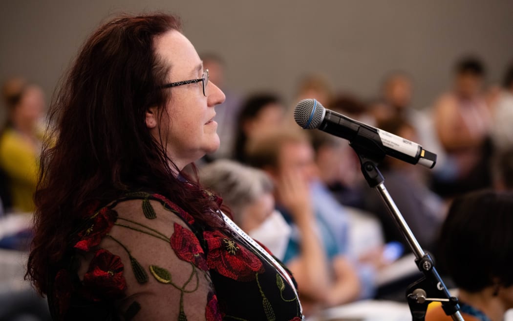 Katie Ben, an anesthetist from Nelson, questions Health Minister Andrew Little about the timeframe to reduce inequity in the health system.