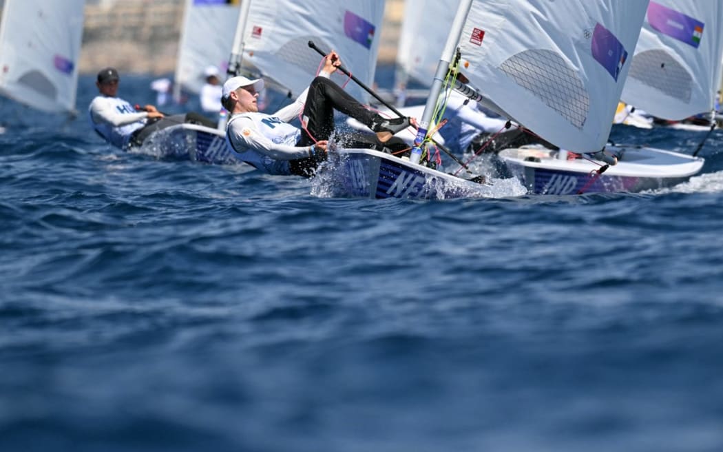 Netherlands' Duko Bos competes in race 7 of the men’s ILCA 7 single-handed dinghy event during the Paris 2024 Olympic Games sailing competition at the Roucas-Blanc Marina in Marseille on August 4, 2024. (Photo by NICOLAS TUCAT / AFP)