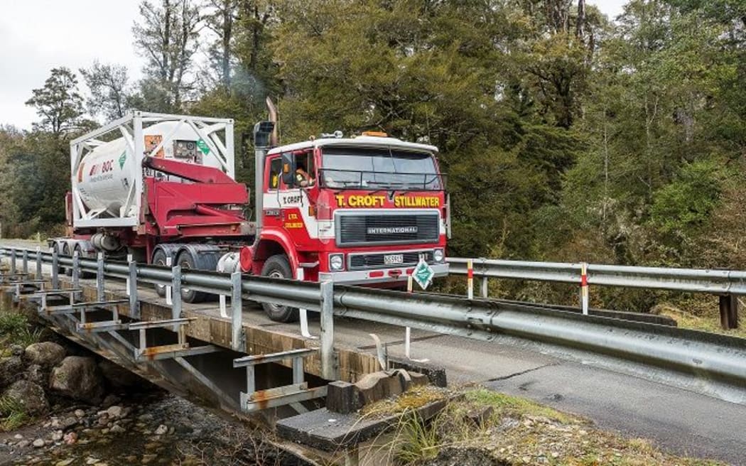 A truck containing equipment to purge Pike River of explosive methane gas is carefully transported towards the mine.