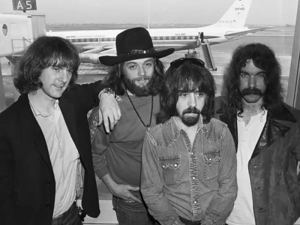 A group shot of the Byrds at an airport