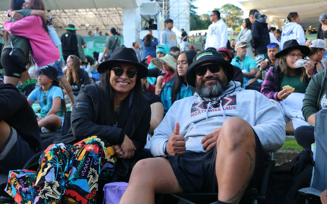 Te Mauri Maniapoto (right), a Ngāti Whakaue supporter arrived with whānau at Pukekura Park around 6am and was one of the first in line.