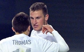 Ryan Thomas celebrates Chris Wood's equaliser with the captain