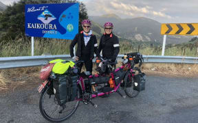 Rachael Marsden and Catherine Dixon and are tandem cycling around the world for charity.