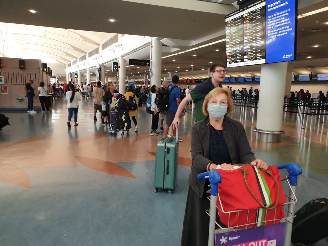 Passengers at Auckland Airport today.