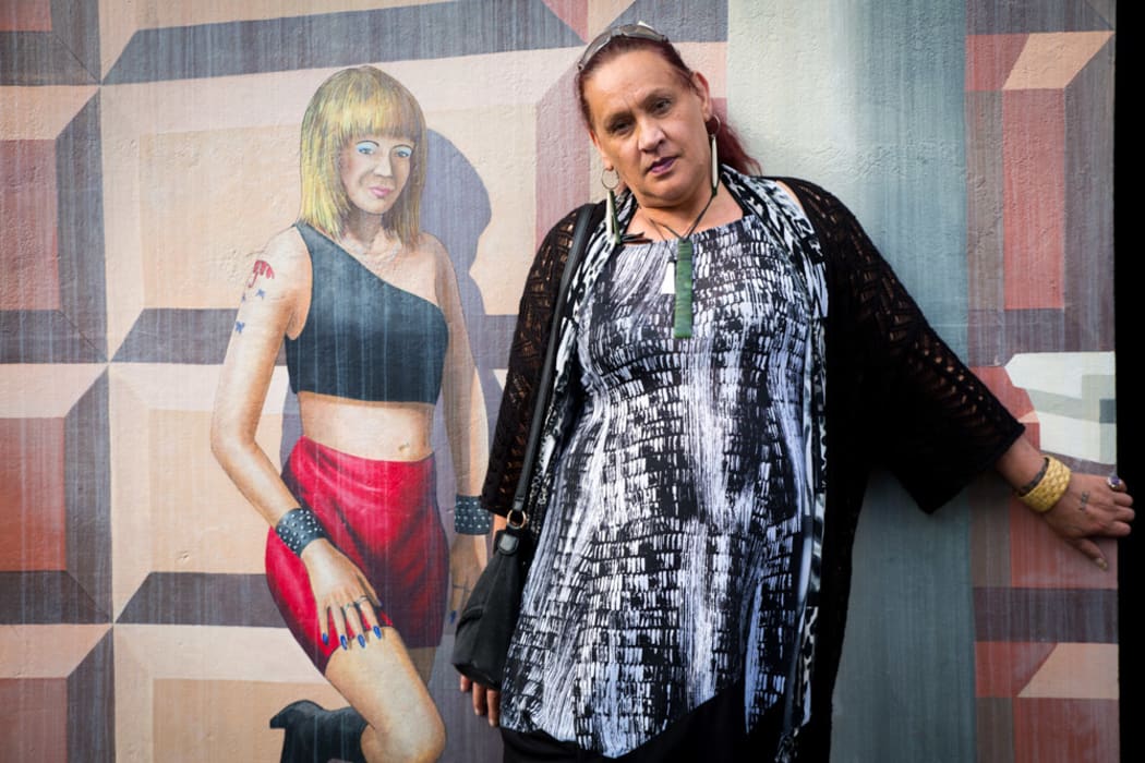 Kayla Riarn with the famous mural on Marion Street, Te Whanganui-ā-Tara.