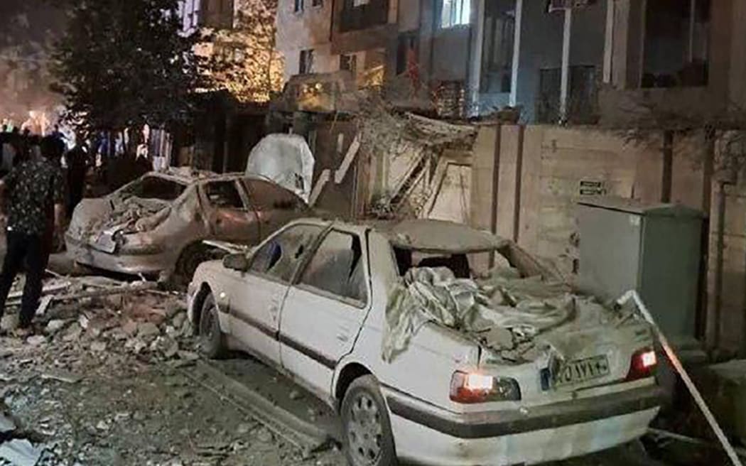 This handout photo released by Iran's Revolutionary Guard Corps (IRGC) official Sepah News Telegram channel on June 13, 2025 reportedly shows a building in Tehran hit in an Israeli strike on the Iranian capital early in the morning. Israeli Prime Minister Benjamin Netanyahu said in a video statement in the early hours of June 13 that Israel carried out strikes on Iran and the military operation against the Islamic republic would "continue for as many days as it takes". (Photo by SEPAH NEWS / AFP) / RESTRICTED TO EDITORIAL USE - MANDATORY CREDIT "AFP PHOTO / SEPAH NEWS " - NO MARKETING NO ADVERTISING CAMPAIGNS