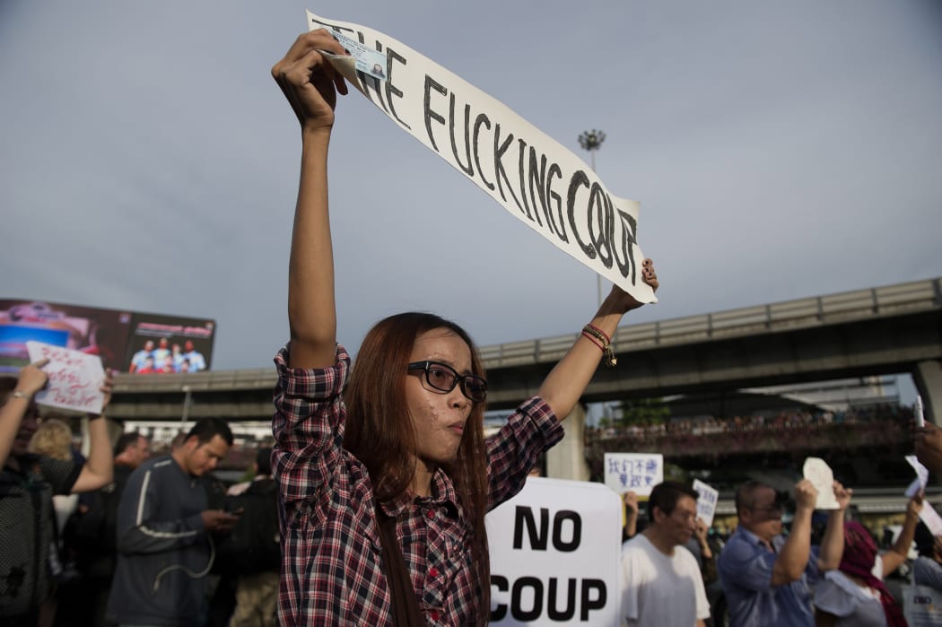 Thai protesters march against the military coup.