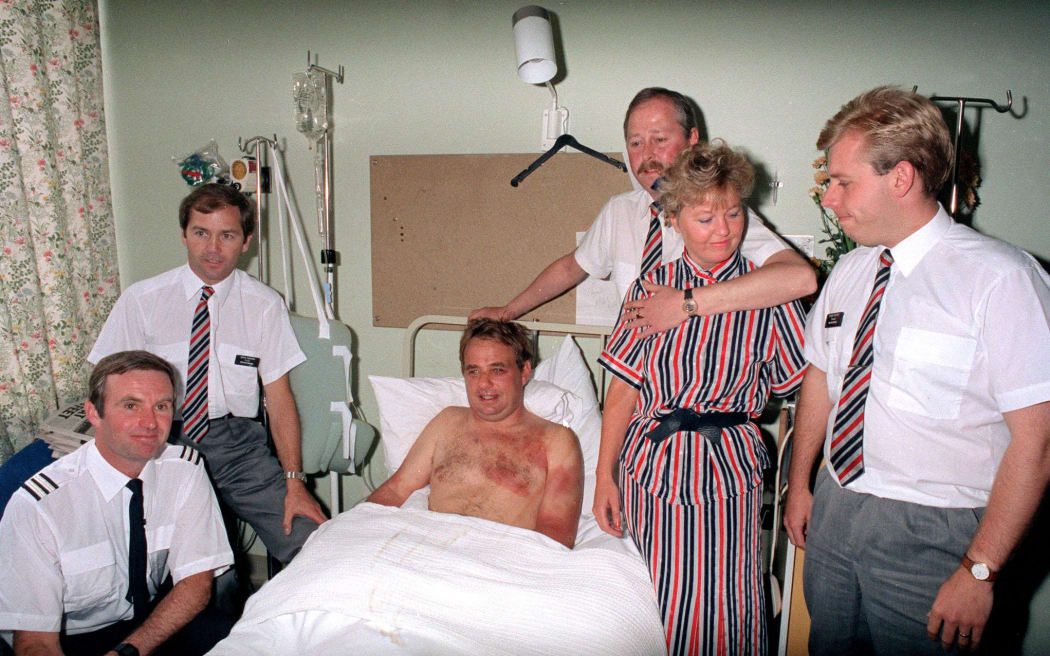 Captain Timothy Lancaster (in bed) recovering in Southampton General Hospital after having been nearly sucked from the cockpit of his jet. With him are crew members (l-r) Alistair Atchison, John Howard, Nigel Ogden, Susan Prince and Simon Rogers who were collectively chosen as man of the year by the Royal Association for Disability and Rehabilitation.