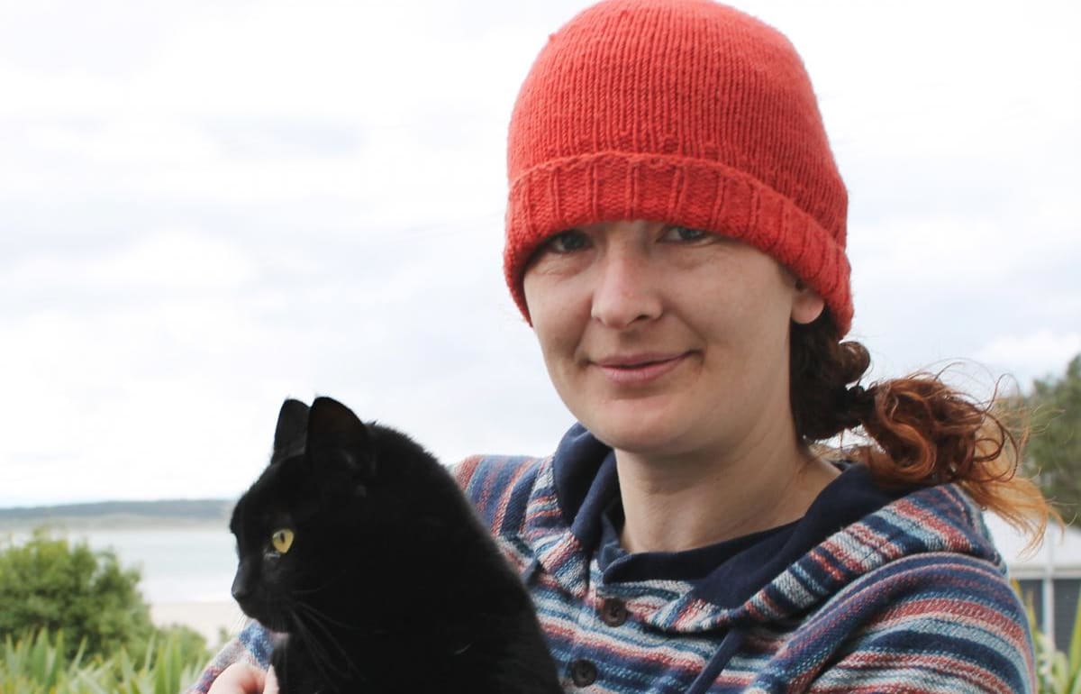 Cat-lover Nico Jarvis, of Omaui, holding her neighbour’s 8-year-old cat, Nhabuz Fishaw.