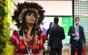 Walelasoetxeige Paiter Bandeira Surui, an indigenous activist from the Paiter Surui people of the state of Rondonia, Brazil poses for a photograph on the sidelines of the COP26 UN Climate Change Conference.