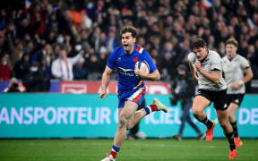 France's wing Damian Penaud runs for his crucial try.