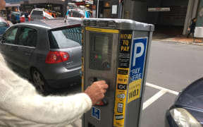 A file photo of someone paying for parking in Wellington's CBD