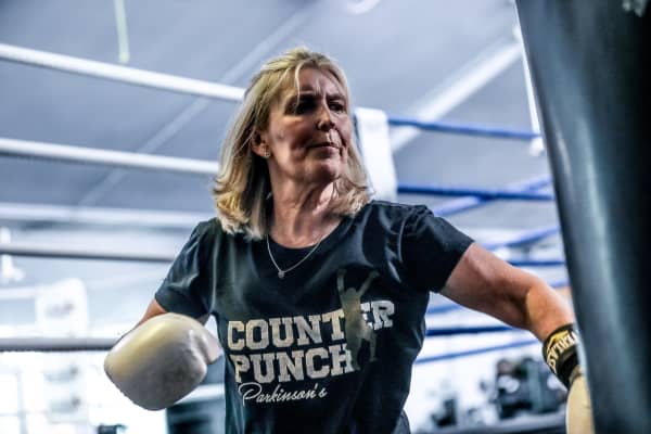 Johanna Quirk is using a boxing bag at a Counterpunch class in Auckland.