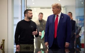 This handout photograph released by the Ukrainian presidential press service on September 27, 2024 shows Ukrainian President Volodymyr Zelensky (L) and Republican presidential nominee former US President Donald Trump meeting on September 27, 2024 in New York. - The meeting coincides with Zelensky's visit to New York for the United Nations General Assembly.