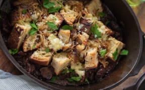 Beef and mushroom stew with sourdough, caramelised onions and cheddar topping