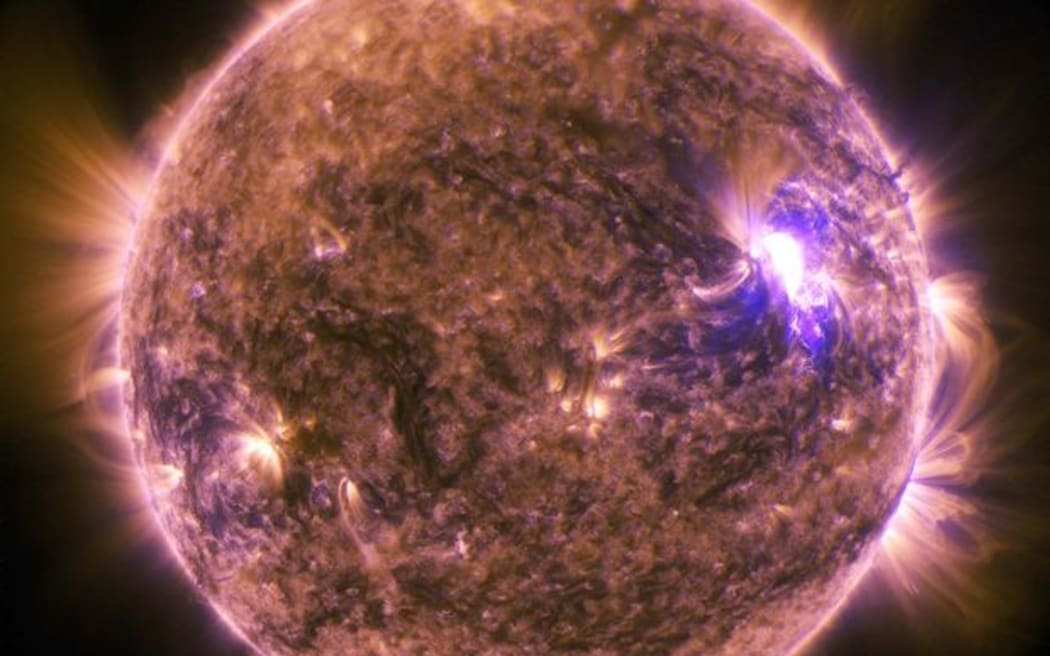 This NASA image obtained June 27, 2015 shows The sun as it emitted a mid-level solar flare, an M7.9-class, peaking at 4:16 a.m. EDT on June 25, 2015.