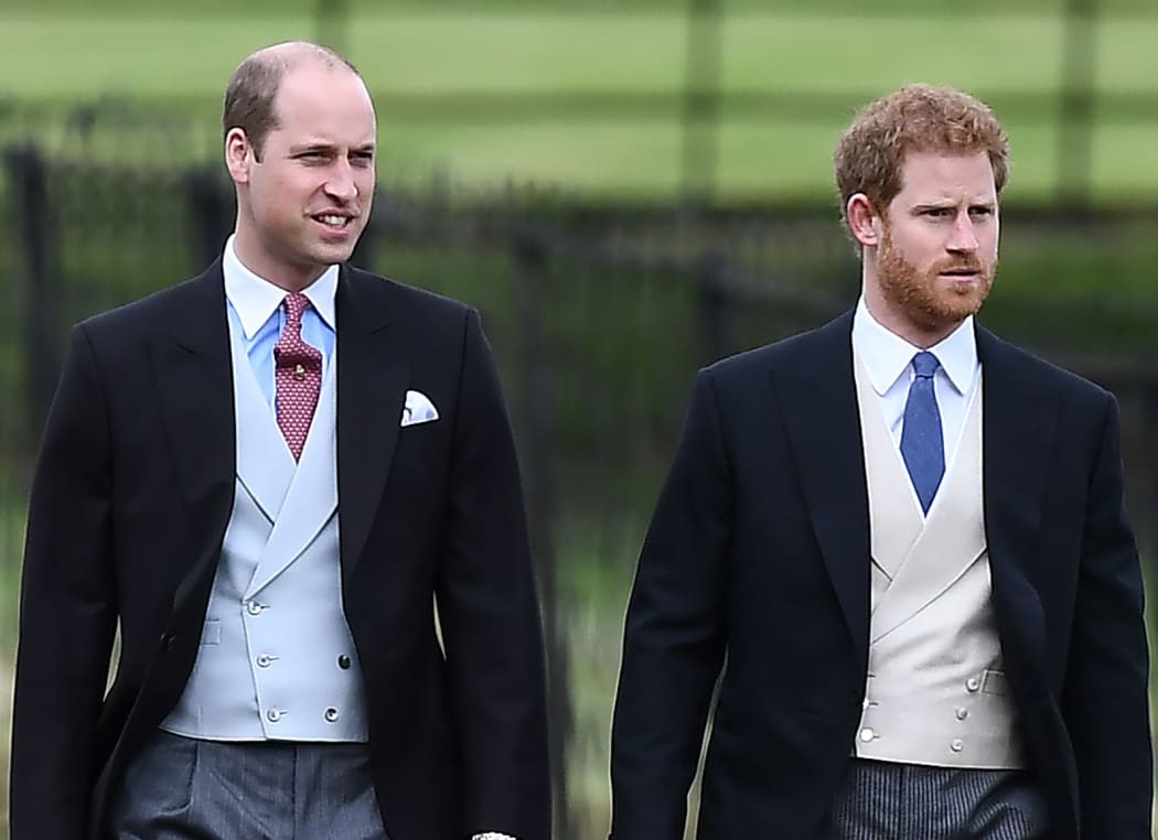 Britain's Prince Harry (R) and Britain's Prince William, Duke of Cambridge walk to the church