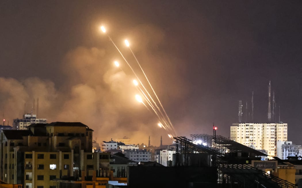A salvo of rockets is fired by Palestinian militants from Gaza City toward Israel, on 8 October, 2023.
