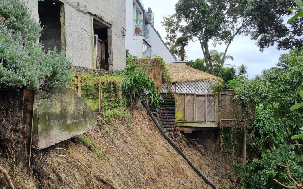 The slip on London Road, Ponsonby, that opened up after heavy rains caused flooding and damage throughout Auckland. 30 January 2023

Stmarys-slips-pkg/web - London St residents quiz a WaterCare Services contractor about their stormwater issues

slips on London St, St Mary's Bay

Karl Browne with slip on his property (eyes down) and his neighbours slip

blocked drains on London St