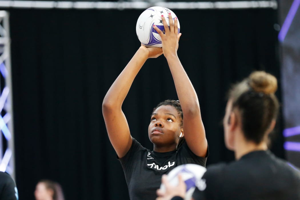 Maia Wilson looks on as Grace Nweke warms up before the Cadbury Netball Series in Palmerston North, October 2020.