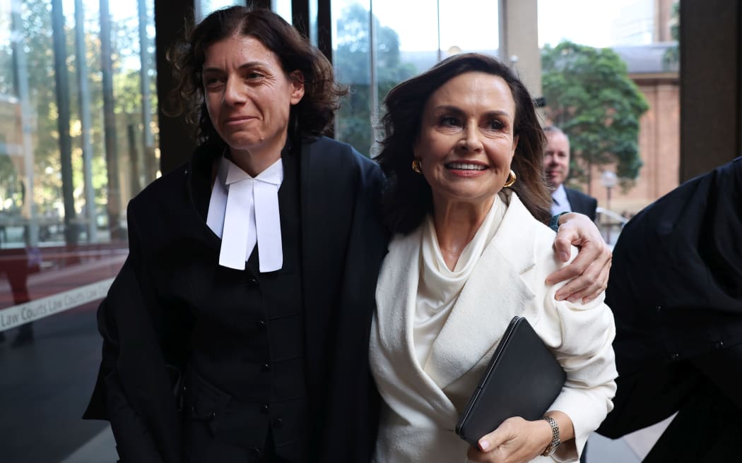 SYDNEY, AUSTRALIA - APRIL 15: Sue Chrysanthou SC hugs Lisa Wilkinson as they emerge from court on April 15, 2024 in Sydney, Australia. Justice Michael Lee has ruled in favour of Network Ten and journalist Lisa Wilkinson in Bruce Lehrmann's defamation case. The case arose from allegations aired on 'The Project' news program, in which Brittany Higgins claimed she was raped by a colleague in Parliament House. Lehrmann, who denied any sexual contact with Ms Higgins, alleged defamation by the broadcast, despite not being explicitly named. The court found that Lehrmann had raped Brittany Higgins on the balance of probabilities.  (Photo by Don Arnold/Getty Images)
