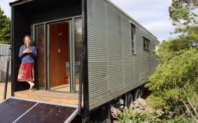 Kath Irvine on the porch of her housetruck