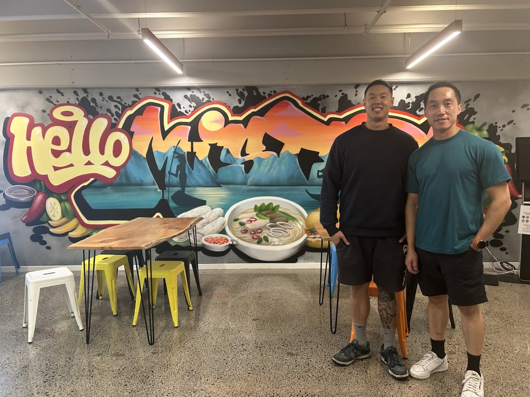 A picture of two people inside a restaurant. Pictured Mike Lee and Jason Kit.