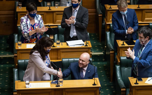 Christopher Luxon is applauded by his team and congratulated by his deputy Nicola Willis after his adjournment debate speech