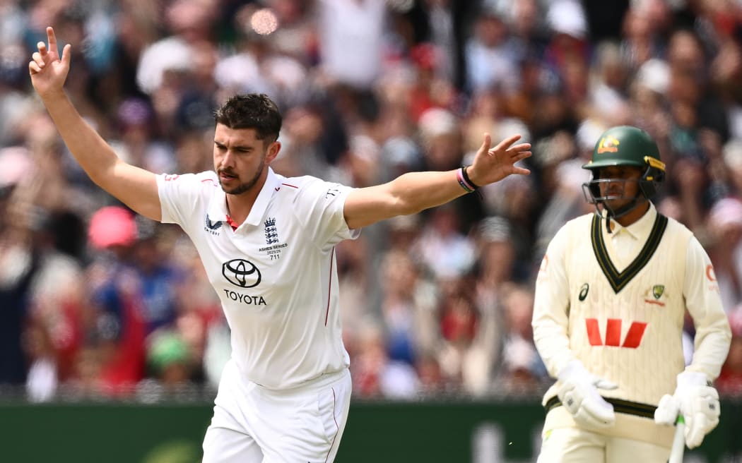 Josh Tongue of England celebrates dismissing Australia's Steve Smith.