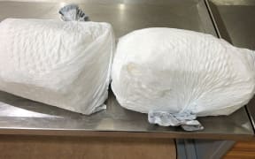 Two bags of methamphetamine weighing 20kg were found in a suitcase.