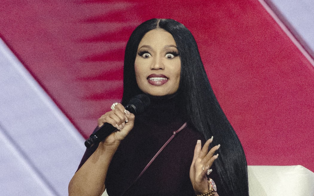 US rapper Nicki Minaj speaks on stage during Turning Point's annual AmericaFest conference in Phoenix, Arizona on 21 December 2025. This year’s conference commemorates the late right-wing activist Charlie Kirk, who was fatally shot on a Utah college campus in September, sparking an outpouring of grief among conservatives and prompting President Donald Trump to threaten a crackdown on the "radical left."