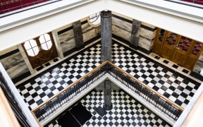 Looking down into the foyer atrium at Parliament House in Wellington. The area referred to as The Tiles where MPs are interviewed on their way to the debating chamber is at the bottom.